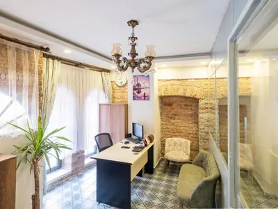 an office with a desk with a computer and chairs at The Red Tent Social Hostel in Istanbul