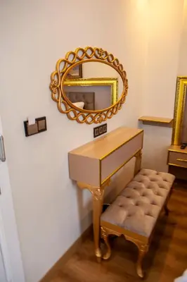 a dressing table with a mirror and a stool at Blue Zerzevan Konak Hotel in Istanbul
