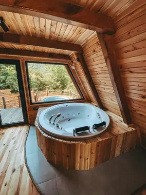 a large wooden room with a large tub in a cabin at Loca Sapanca Bungalov in Sapanca