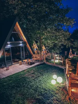 a log cabin with a deck and a yard at Loca Sapanca Bungalov in Sapanca