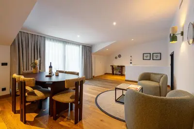 a living room with a table and chairs at Ando Living Taksim House in Istanbul