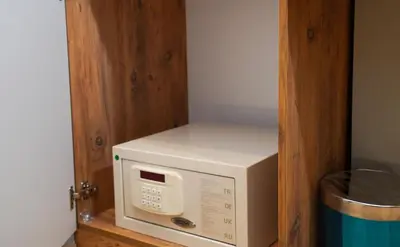 a white microwave oven in a wooden cabinet at Fidan City Hotel in Istanbul