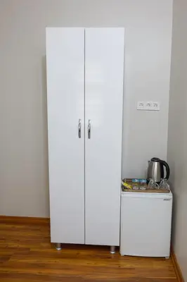 two white cabinets in a room with a table at Fidelya Boutique Hotel in Sultanahmet