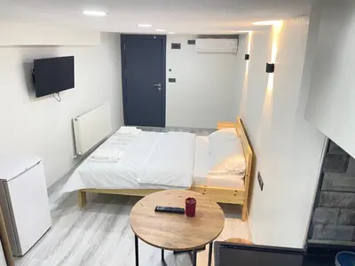 a small room with a bed and a table at La Perato in Istanbul