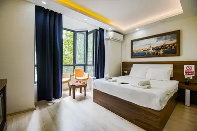 a hotel room with a bed and a window at MITANI SUITES in Istanbul