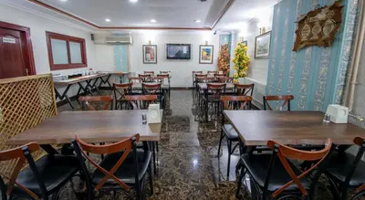 a restaurant with tables and chairs in a room at OTEL ÜMIT İSTANBUL in Istanbul