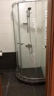 a shower with a glass door in a bathroom at Kilit no 1 in Istanbul