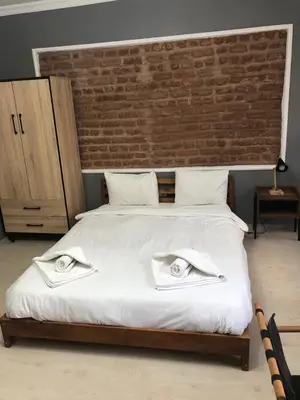 a bedroom with a large bed with two towels on it at Kilit no 1 in Istanbul