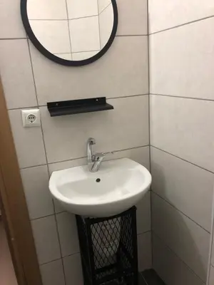 a bathroom with a sink and a mirror on the wall at Kilit no 1 in Istanbul