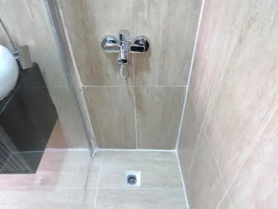 a shower in a bathroom with a shower head at Istanberry - Luna Apartments in Istanbul