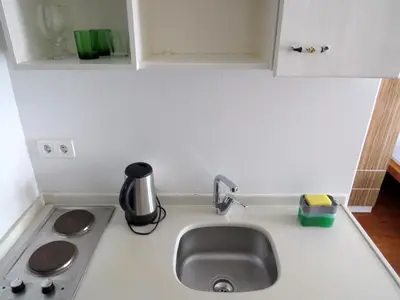 a kitchen counter with a sink and a stove at Istanberry - Luna Apartments in Istanbul