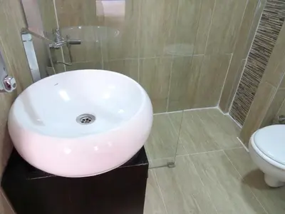 a bathroom with a white sink and a toilet at Istanberry - Luna Apartments in Istanbul
